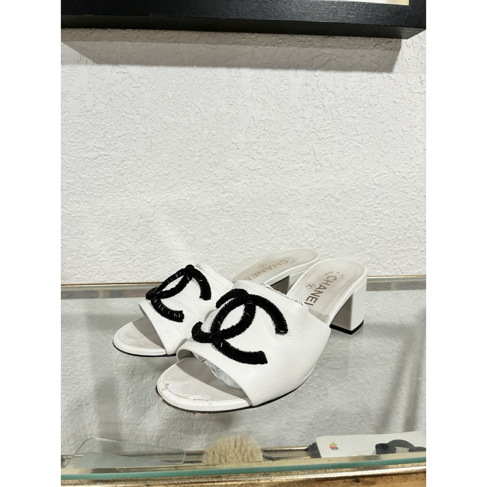Chanel White Leather Open-Toe Mules with Black CC Appliqué